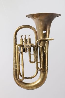 an old brass tuba is shown against a white background