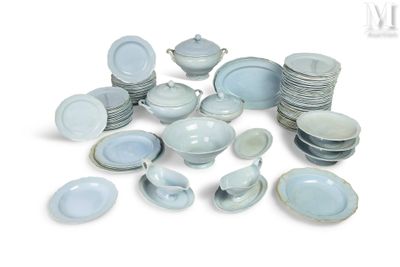 a pile of blue and white plates and bowls
