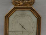 a gold clock with a clock face on it