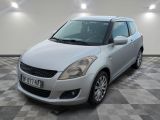a picture of a small silver car parked in a garage