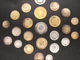 many different types of coins arranged in a circle