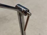 a close up of a metal pole with a handle on it