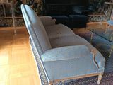 a living room with a couch, chair, and television in it