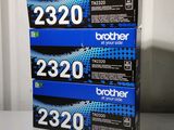 three brother black and blue toner cartridges sitting on a table