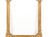 an old gold frame with a white background and a white wall