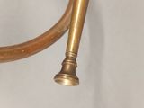 a close up of a brass pipe on a white background