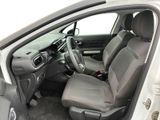 the interior of a car with the door open showing the driver ' s seat area