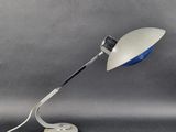 an image of a desk lamp with a white base and a blue shade