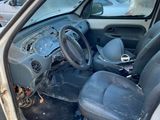 the interior of a car with the door open and the driver ' s seat down