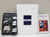 a box of underwear and a book on a table