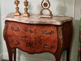 a picture of a table with a clock on top of it