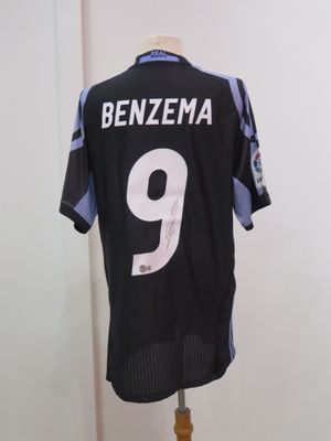 the jersey is black and white with a number 9 on it