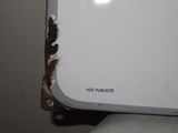 a close up of a white electronic device with rust on it