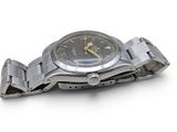 an image of a close up of a wrist watch on a white surface