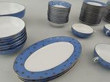 a lot of plates and bowls on the table