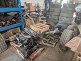 a pile of tires and other parts in a garage