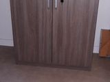 a small cabinet in the corner of a room