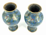 two vases that have been painted with flowers on them