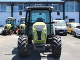 a tractor that is parked in a parking lot