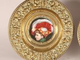 pair of gold plate with miniature portraits of a man and a woman