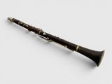 a close up of a clarinet on a white surface with a white background