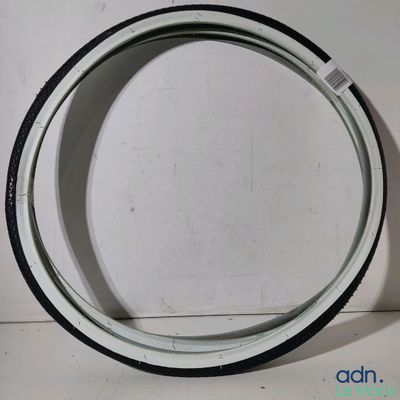 a close up of a white and black rim on a white surface