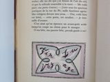 an open book with a picture of a butterfly on it