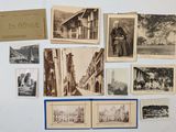 many old photographs of people and buildings on the wall