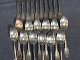 a lot of silver spoons and spoon spoons on a table