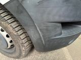 a close up of a car tire with a flat tire