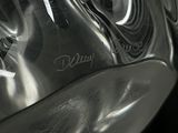 a close up of a glass vase with a writing on it