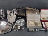 a lot of silver items that are on a table