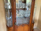 a glass cabinet with a lot of wine glasses in it