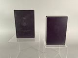 pair of clear acrylic book stands with black covers