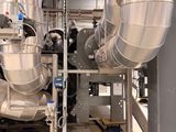 a large metal pipe in the middle of a room