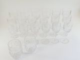 a lot of glasses that are sitting on a table