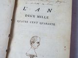 an old book with a drawing of a bust on it