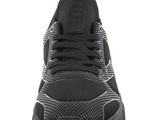 a close up view of a pair of black sneakers on a white background