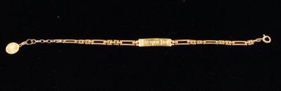 an image of a gold bracelet on a black background