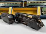 several toy trains are sitting in a display case on a table