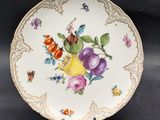 a plate with flowers on it sitting on a table