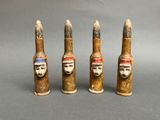 three small wooden sculptures of a man ' s head and a woman ' s head