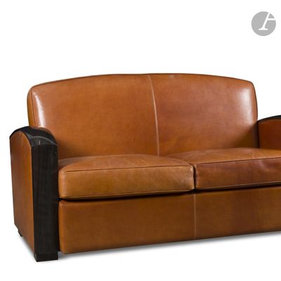 a brown leather couch with black legs on a white background