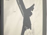 a black and white photo of an airplane flying in the sky