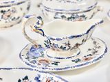 many plates and cups that are on a table