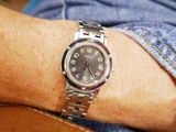 a man that is wearing a watch on his wrist