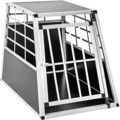 une cage pour chien noire et blanche, surmontée d'une cage métallique
