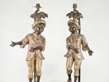 pair of antique bronze figurines of a man and a woman