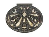 a black and white picture of a broochle with a bird on it