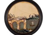 une photo d'un tableau dans un cadre noir accroché au mur
